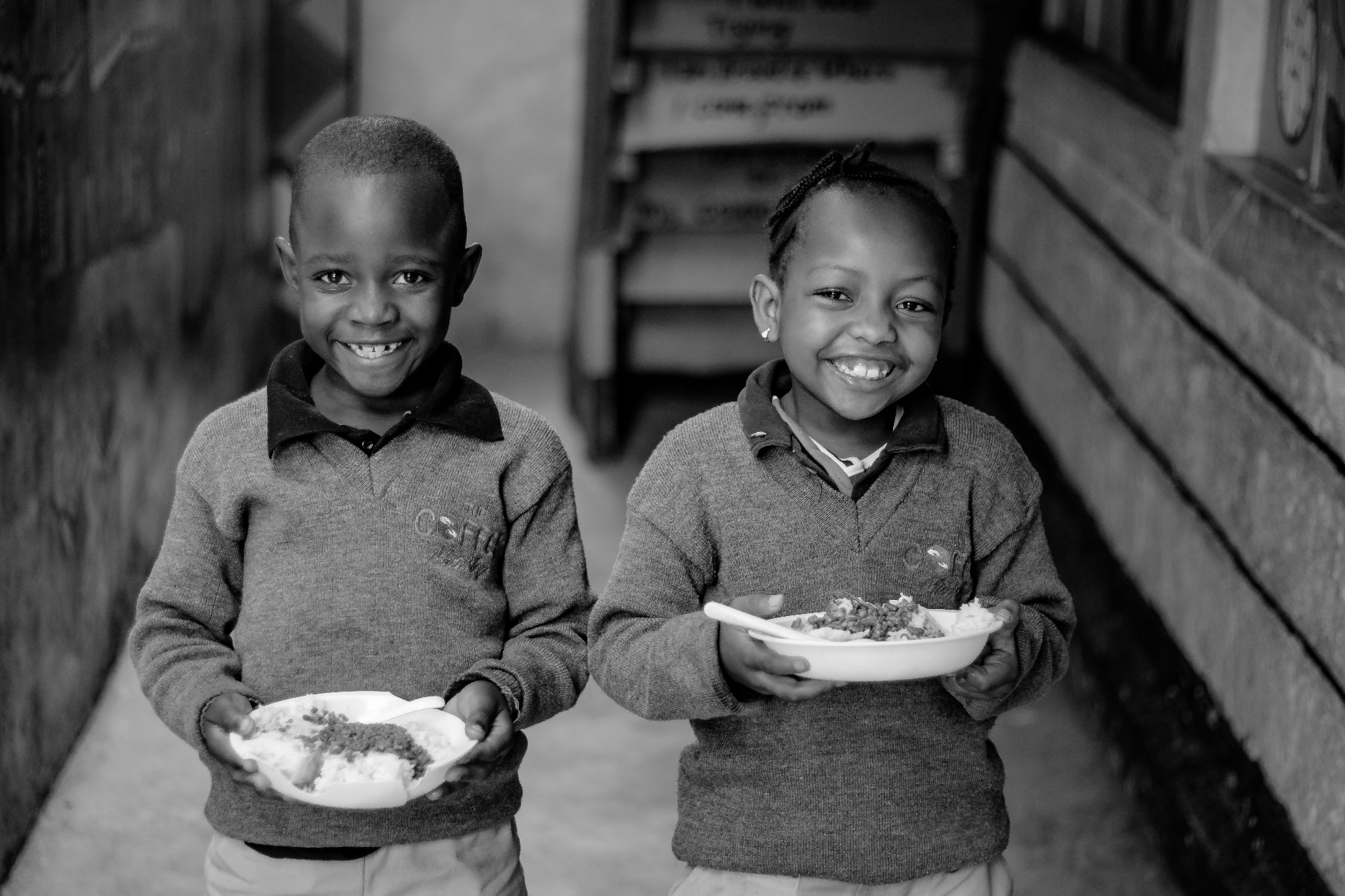 Children sharing a meal through the ministry's programs